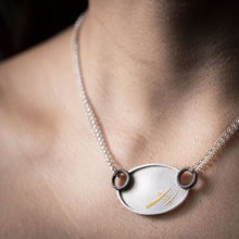 Load image into Gallery viewer, Model wearing silver and gold XOXO necklace with 18” sterling silver necklace chain