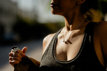 Load image into Gallery viewer, Woman model wearing triple silver necklace made with broken sterling silver studs in a casual tank top