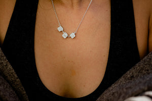 Close up of short silver necklace with triple silver broken studs on a 17” sterling silver necklace chain