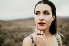 Load image into Gallery viewer, Model wearing red garnet ring, unique light and dark silver bar ring