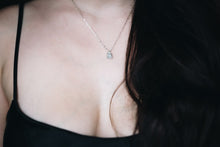 Load image into Gallery viewer, Woman wearing silver chain necklace with broken silver pendant