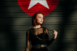 Model wearing 43” steel and silver chain necklace in single loop