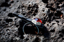 Load image into Gallery viewer, side view of dark silver cocktail bar ring with garnet stone