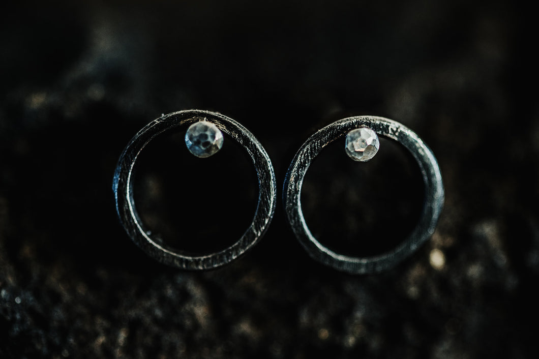 Steel circle earrings with silver studs